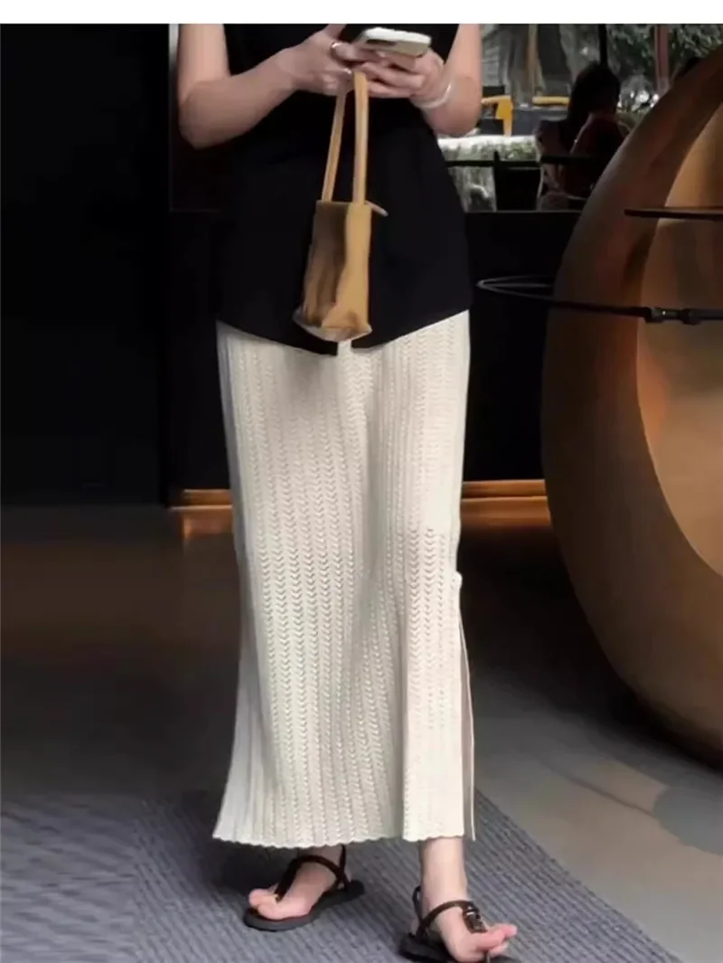 Gonna a trapezio scavata lavorata a maglia albicocca Donna 2025 Nuova primavera autunno Elastico in vita Spacco morbido Gonne temperamento versatile