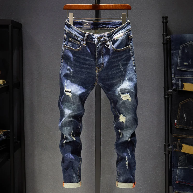 

New spring and summer style Men's tear jeans Elegant motorcycle jeans trousers men Fashionable and versatile ripped slim pants