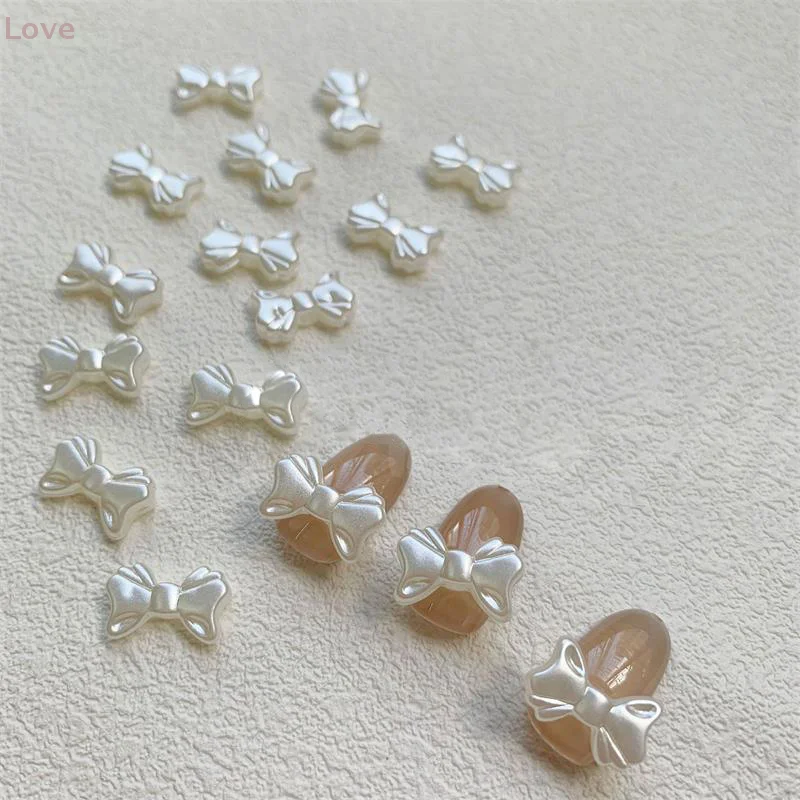 20 قطعة/الحقيبة اللؤلؤ الأبيض الرجعية الفرنسية بسيطة Bowknot مسمار الفن اكسسوارات أنيقة لطيف Bowknot ثلاثية الأبعاد الراتنج لتقوم بها بنفسك مسمار الفن اكسسوارات