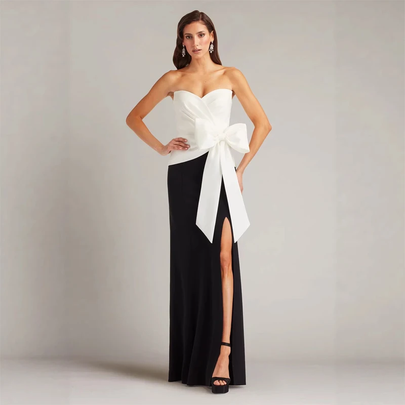 

Hot and trendy celebrity black and white contrasting party evening dress with bow decoration and backless sexy dress