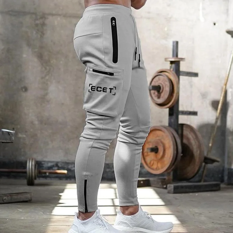 2024 Wiosna i jesień Nowe amerykańskie sportowe męskie kombinezony w jednolitym kolorze Outdoor Leisure Fitness Running Training Pants Odzież