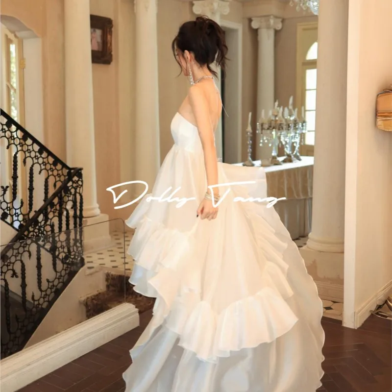 A light luxury dress with short front and long back strapless skirt
