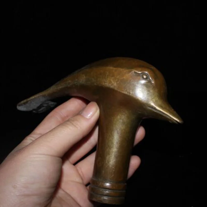 

Early collection of pure copper dolphin bird head and cane head