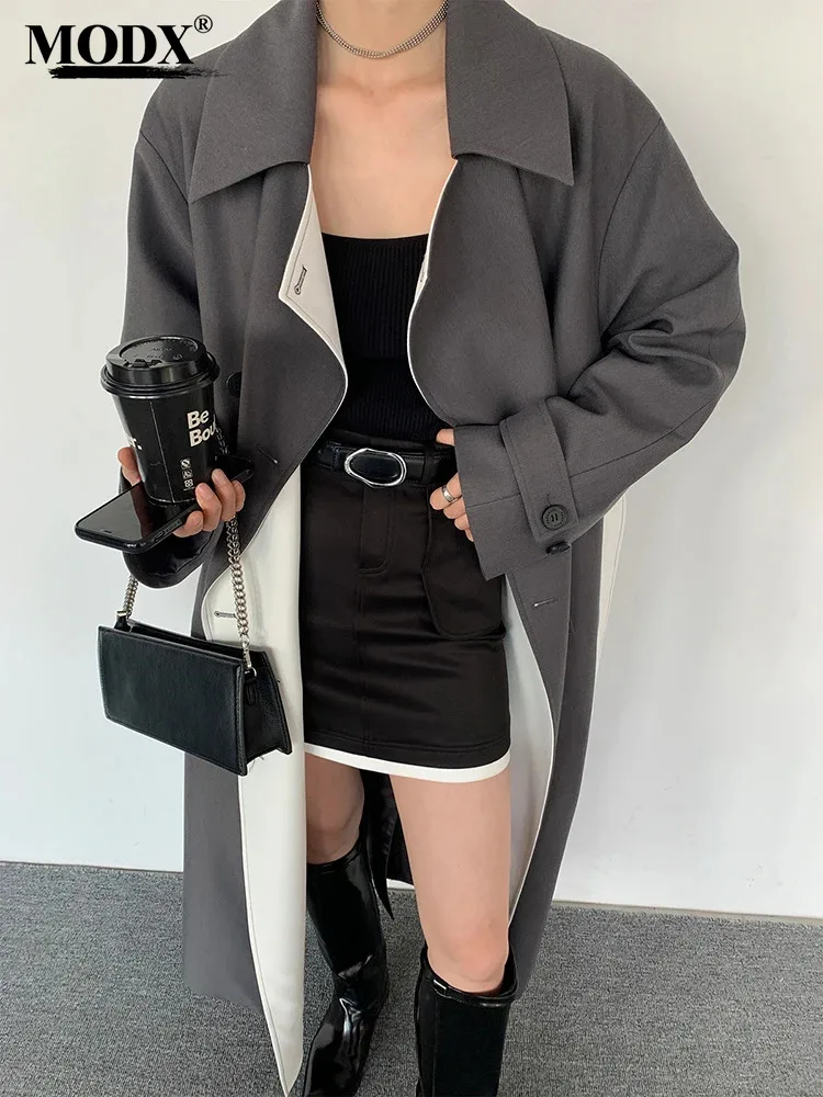 

[MODX] Black Color-block Belted Trench Women New Lapel Long Sleeve Loose Fit Windbreaker Fashion Tide Spring Autumn 2024