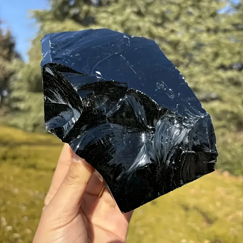 Large raw natural obsidian stones, natural black obsidian stones, natural obsidian for interior decoration.