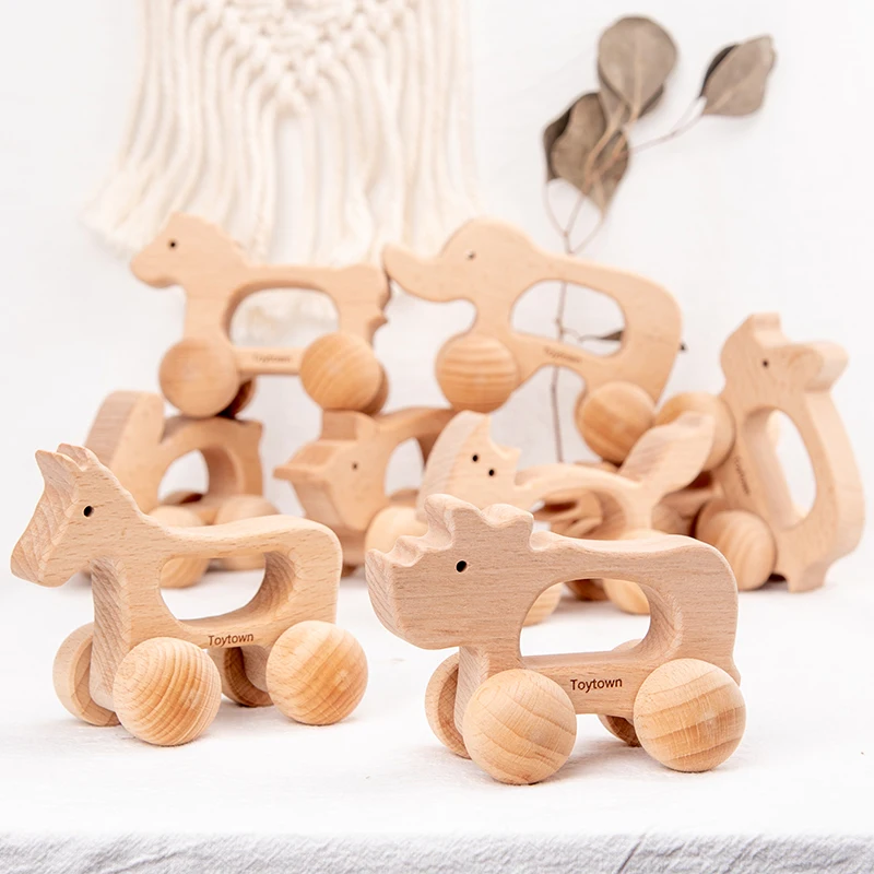 Set di giocattoli a spinta per animali in legno da nove pezzi con coccodrillo, coniglio e altri disegni di animali I bambini hanno esploderà spingendo il c