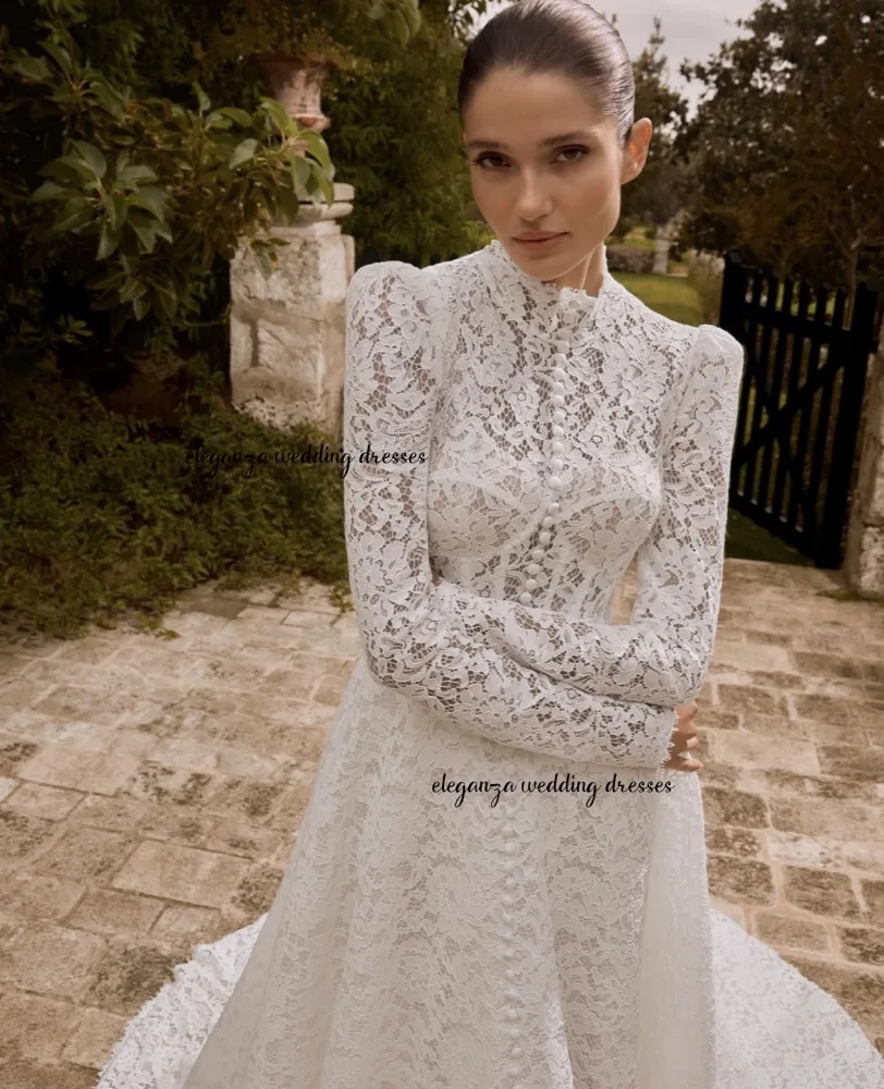 فستان زفاف عربي مخصص برقبة عالية وأكمام طويلة شفاف من خلال الدانتيل على شكل حرف A فستان زفاف سويب تراين للمرأة أماندا نوفيا