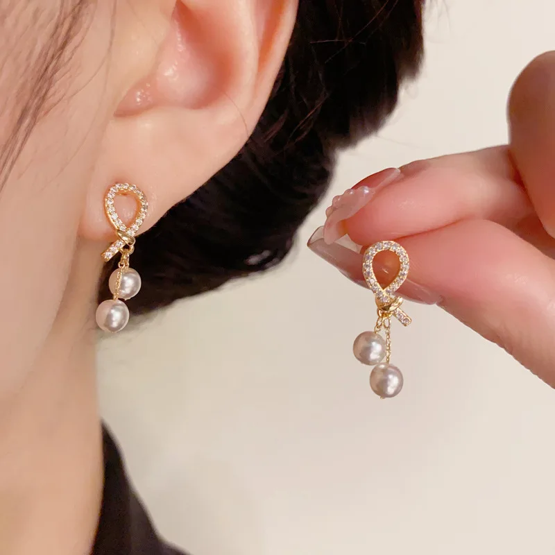 Korean Style Micro Inlaid Zircon Knot Pearl Light Luxury Style Minimalist Earrings for Women Jewelry Weddings Gifts.