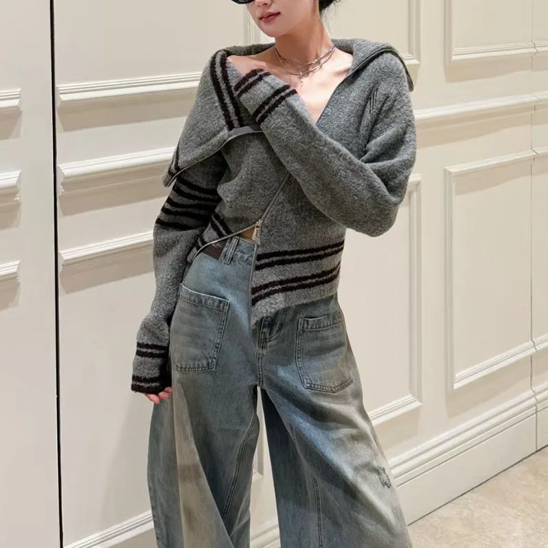 

A retro color-blocking striped lapel knitted cardigan for women with a slanted zipper design, a niche sweater coat