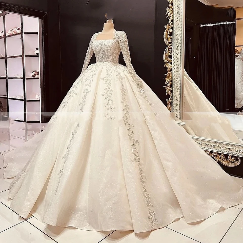 

2025 Customized Long Sleeves Sequin Beaded Wedding Dress Ball Gown Floor Length Sweep Train Tulle Lace Up Bridal Gown