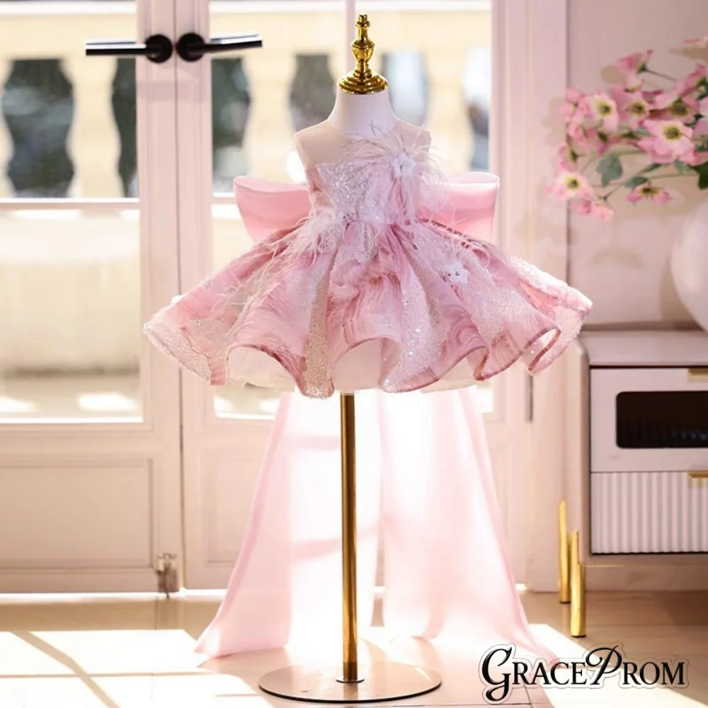 

Elegant Pink Glitter Flower Girl Dress with Feather Floral Details Sheer Neck Large Back Bow Kids Wedding Pageant Princess Gown