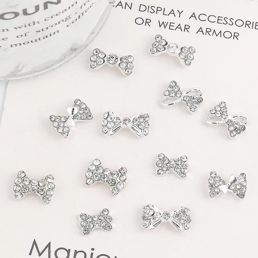 SANANIE 10PCS Shiny White Rhinestone Bow Nail Art Charms 3D Classic Sliver Alloy Butterfly Nails Decoration Manicure Supplies 4