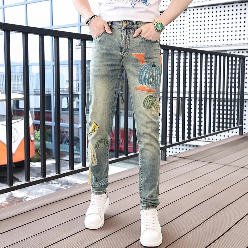 Personalized street fashion pumpkin print men's jeans 2024 spring and summer trend retro casual elastic slim tapered pants