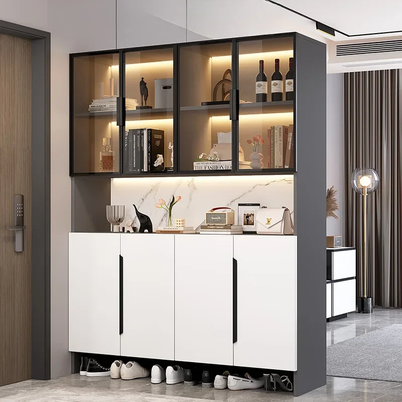 The shoe is integrated against the wall, living room screen is separated from entrance door, and home door is placed