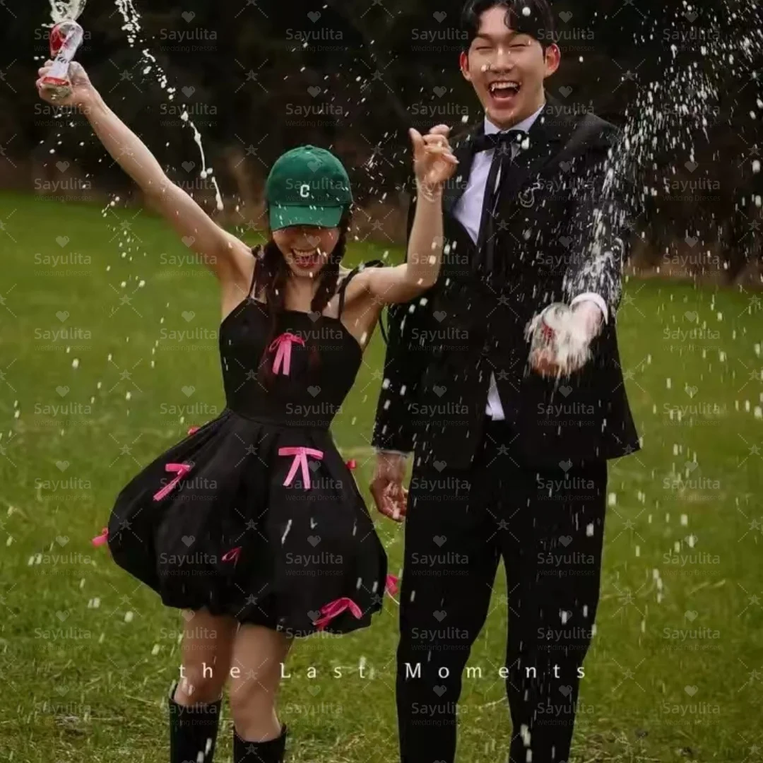 

Sayulita Little Black Prom Dresses Spaghetti Straps Homecoming Party Graduation Dress with Bows Mini Night Club Gowns Customized