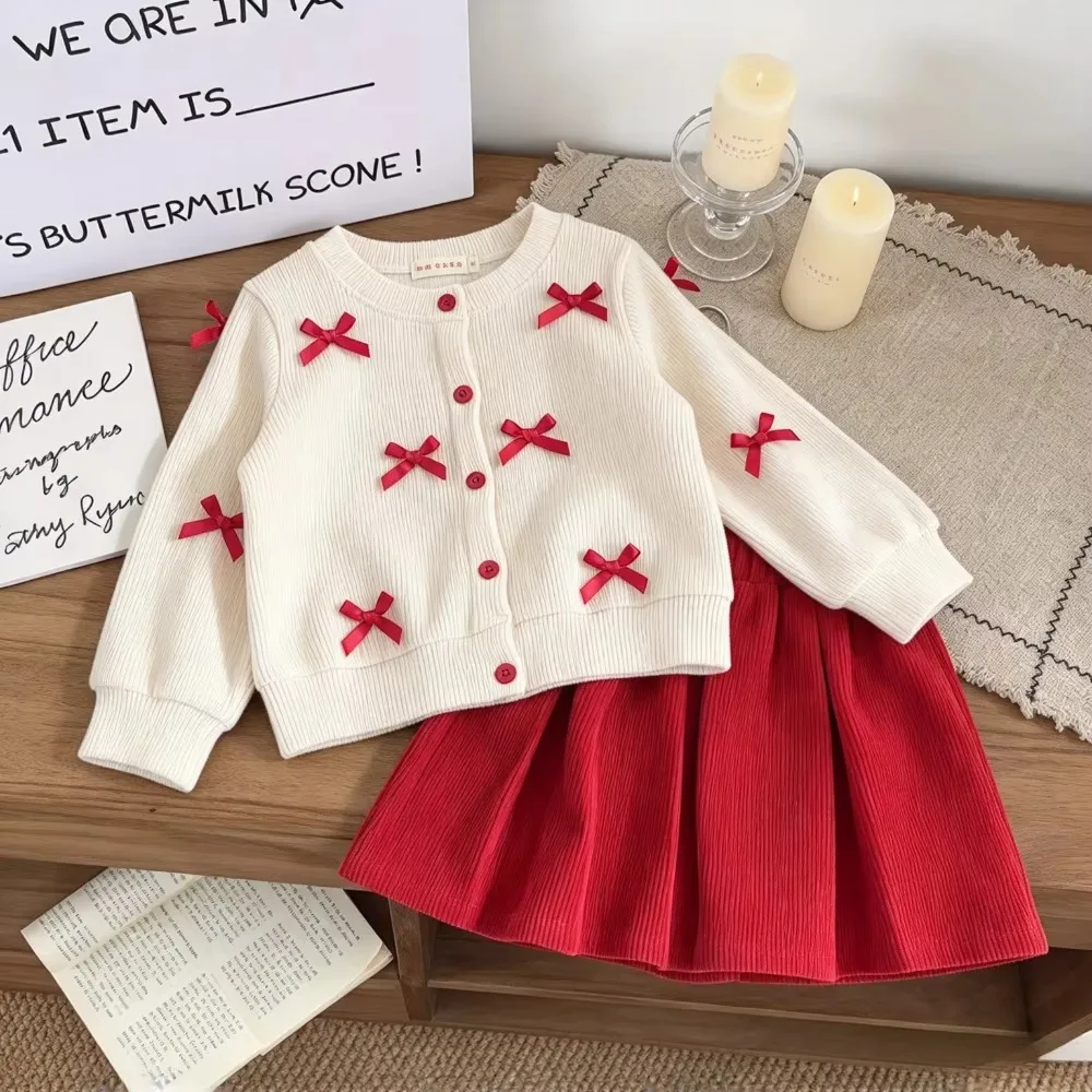 2026 Korean Version Children's Clothing Spring and Autumn New Toddler Girl Clothes Bow Long Sleeved Cardigan + Red Short Skirt