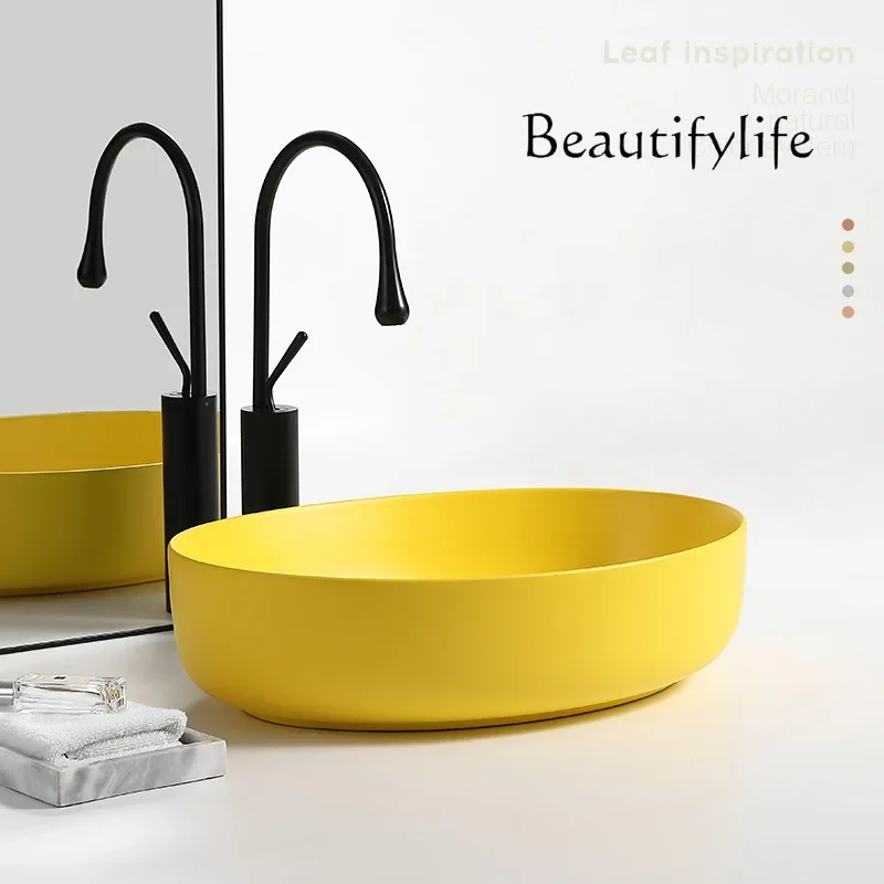 Q Nordic matte yellow countertop basin oval household ceramic wash basin bathroom balcony washbasin surface