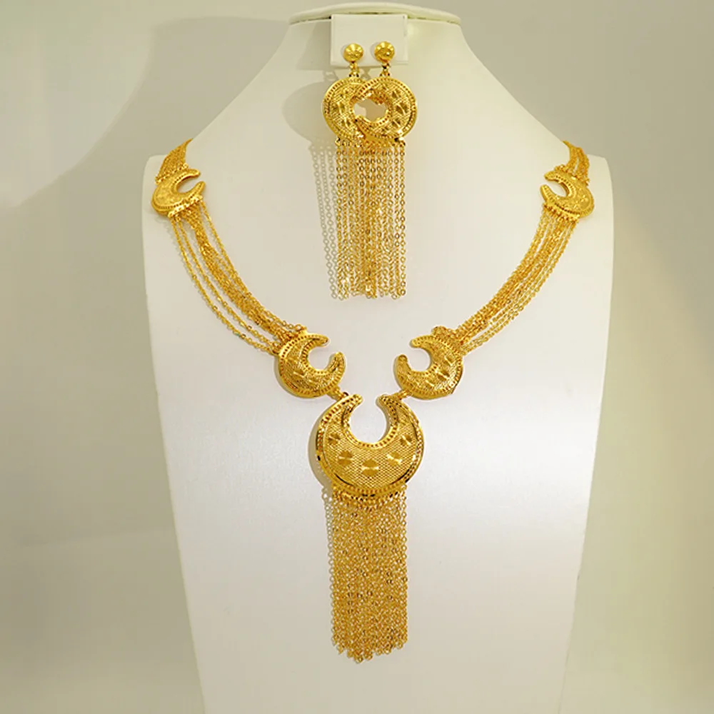 

Women's 24K Gold Double Tassel Set, AU999 | Layered tassels with "Wreathe" engraving & interlocking ring motif.