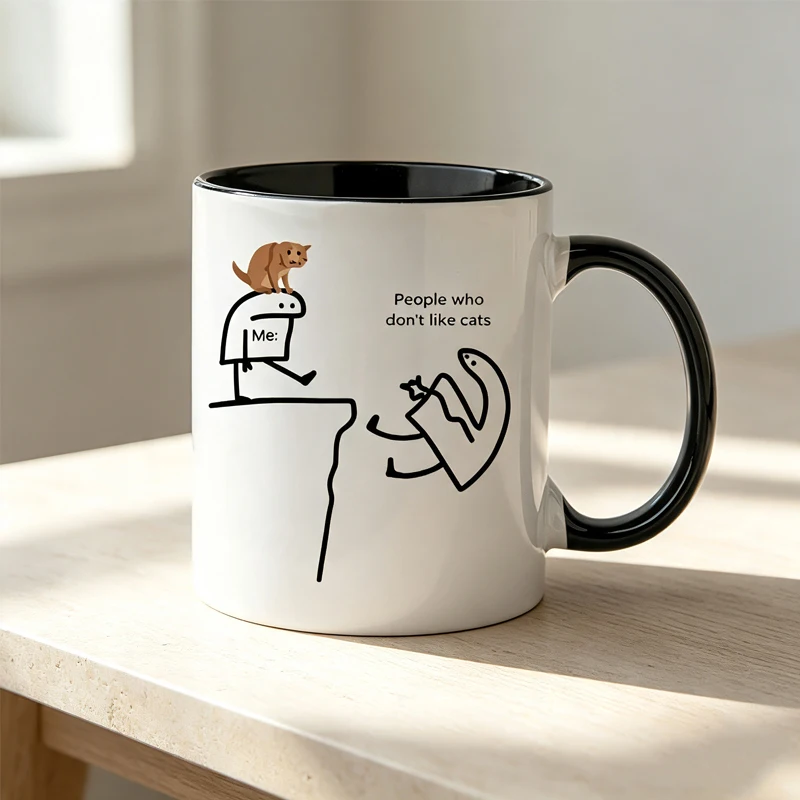 This ceramic coffee mug features a playful cat design and the words 