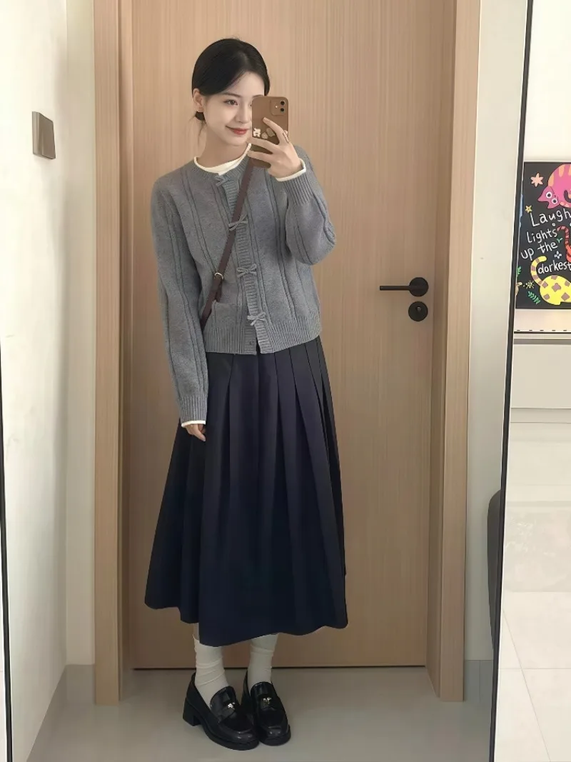 

Новый осенний комплект из двух предметов в консервативном стиле, женский корейский модный вязаный кардиган с длинными рукавами + плиссированная юбка трапециевидной формы, наряд