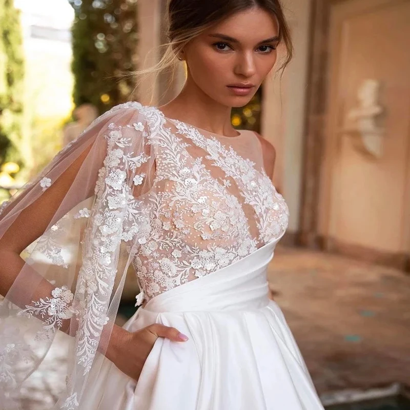 Haute Couture elegante polsino rotatore singolo avorio con Tulle Applique a mano e abiti da sposa a trapezio in raso per donna