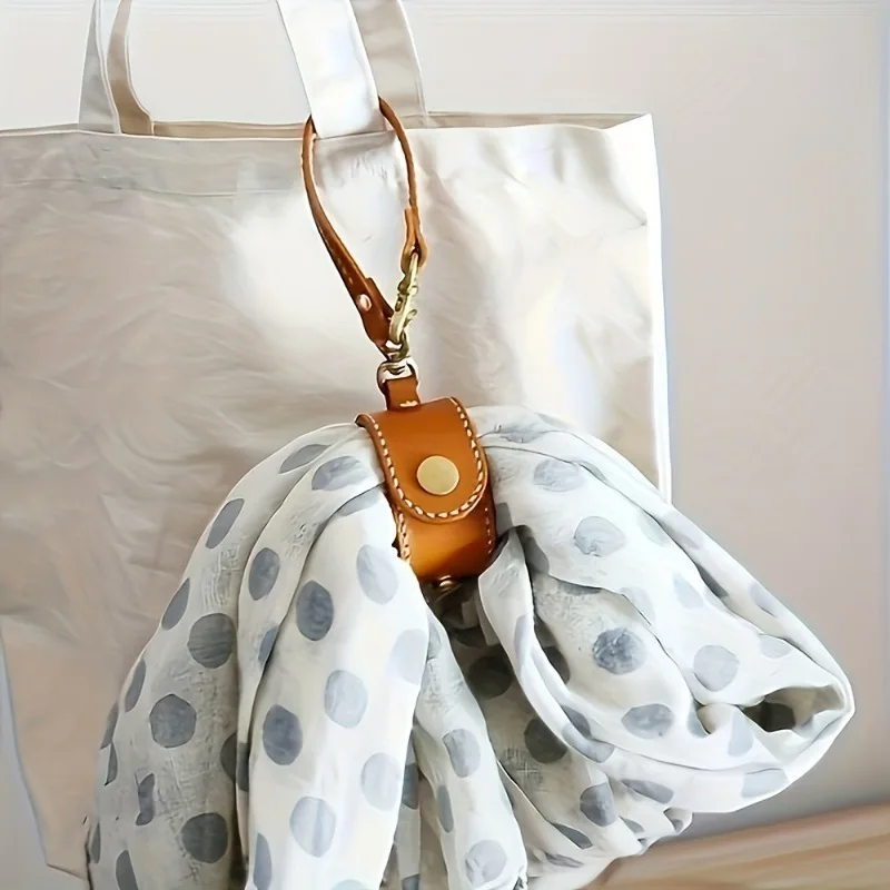Multi functional travel storage clip that combines scarf, hat hanger, and decorative item storage functions