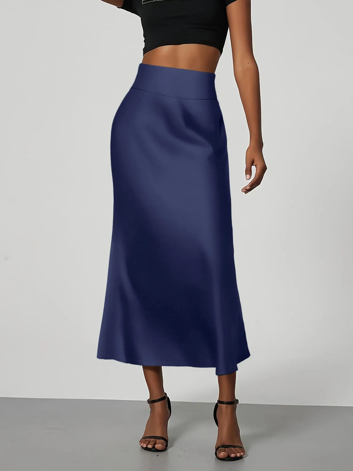 تنورة متوسطة الطول بحورية البحر بلون موحد، مصنوعة من نسيج ناعم ومقاوم للتجاعيد. أسلوب متوسط الطول يسطح الشكل، مما يجعلها