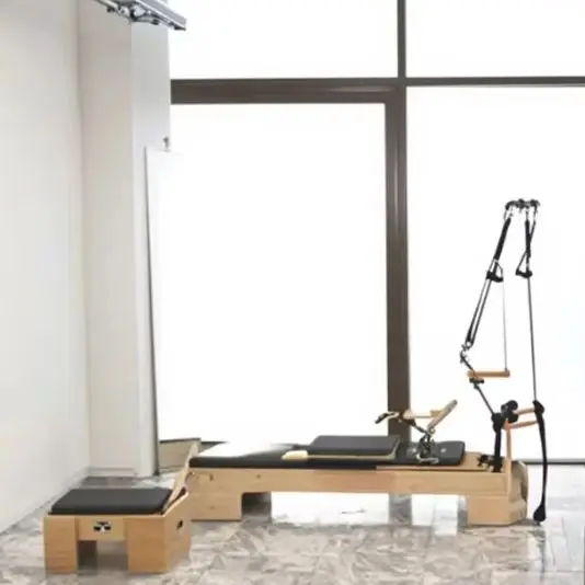 

Хит продаж: прочный регулируемый пилатес-реформер из массива дерева для студий йоги и пилатеса, корректор для пилатеса