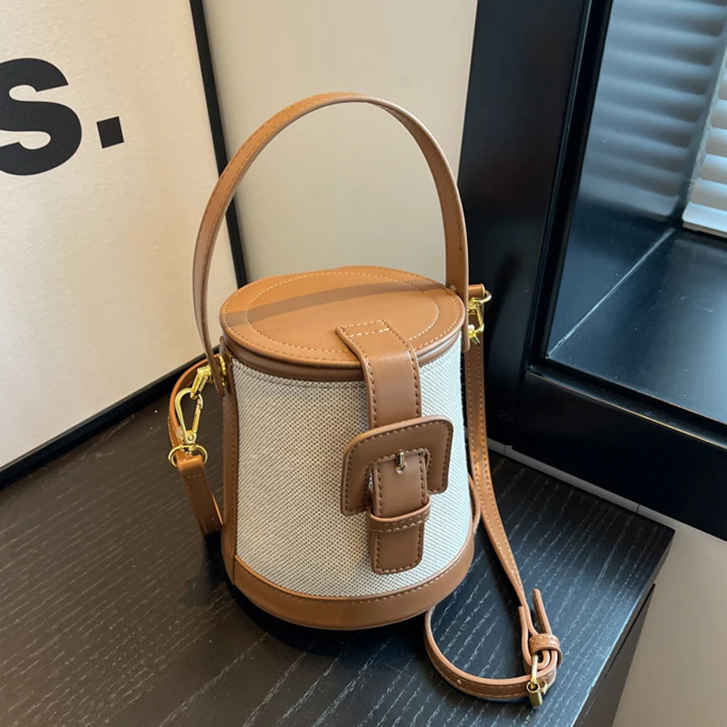    Lekka, luksusowa torebka typu bucket bag w stylu retro dla kobiet, nowość na jesień 2026, szykowna torebka z płótna i PU, elegancka damska torba na ramię.