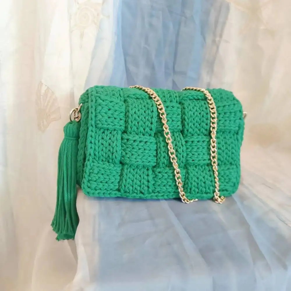 cotton by hand knits bag, single shoulder slope across packets, tasseled cross product package