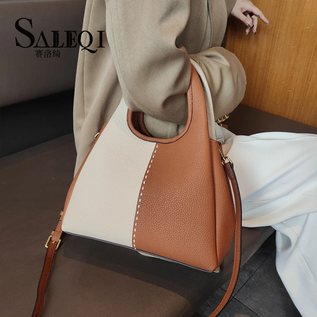 Genuine leather New vegetable basket handbag  simple and versatile  The Korean version of the contrasting color commuting bag