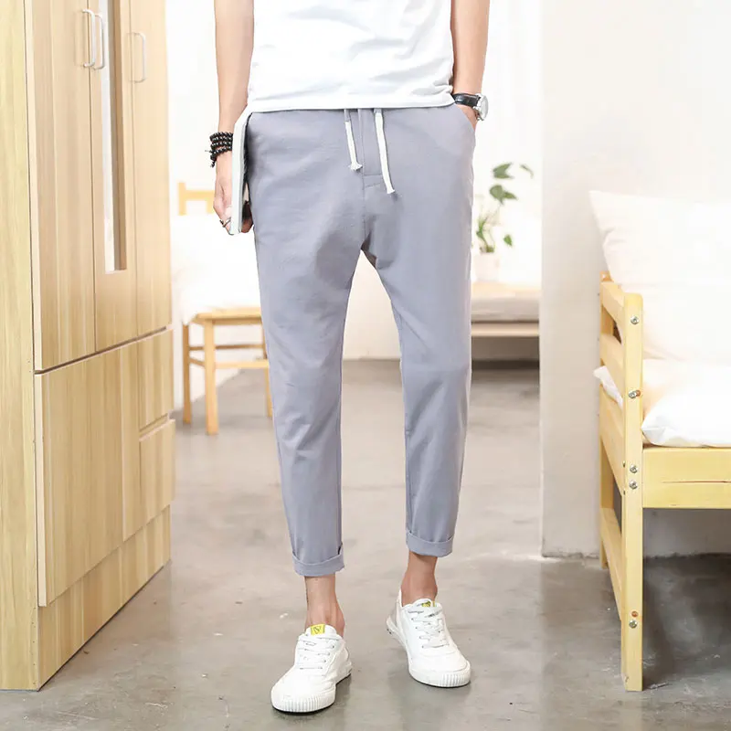 بنطلون رجالي صيفي من القطن والكتان بقصة ضيقة وخفيف الوزن بطول تسعة أرباع، بنمط الشباب الحيوي وخصر متوسط بلون واحد