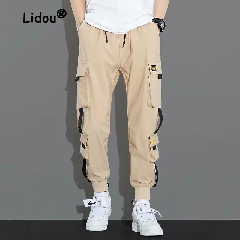 Fashion Personality Multiple Pockets Stickers Waist Drawcord Cargo Pants Man Loose Solid Color Casual Summer Trend Male Trousers