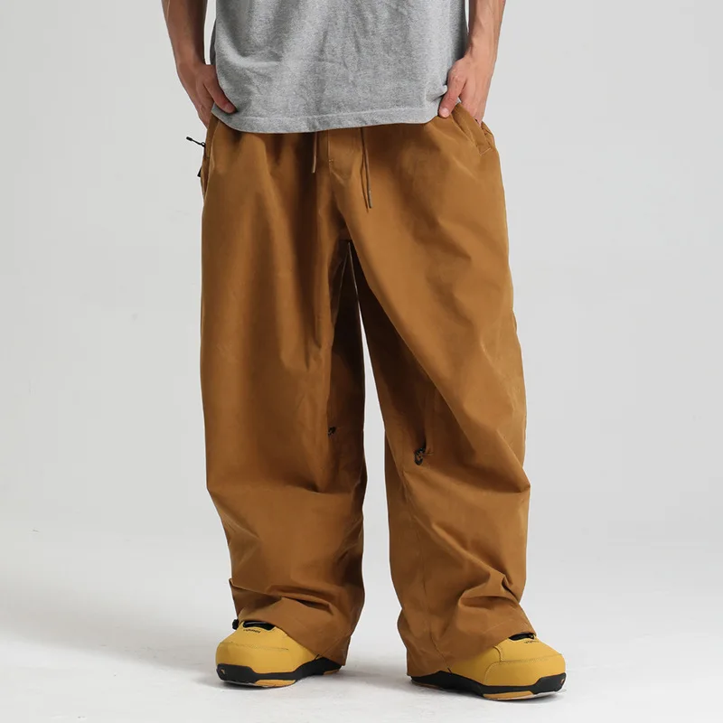 冬のマウンテンスポーツ男性スキーズボン屋外ハイキング女性スノーパンツ緩い防水女性スノーボード服着用