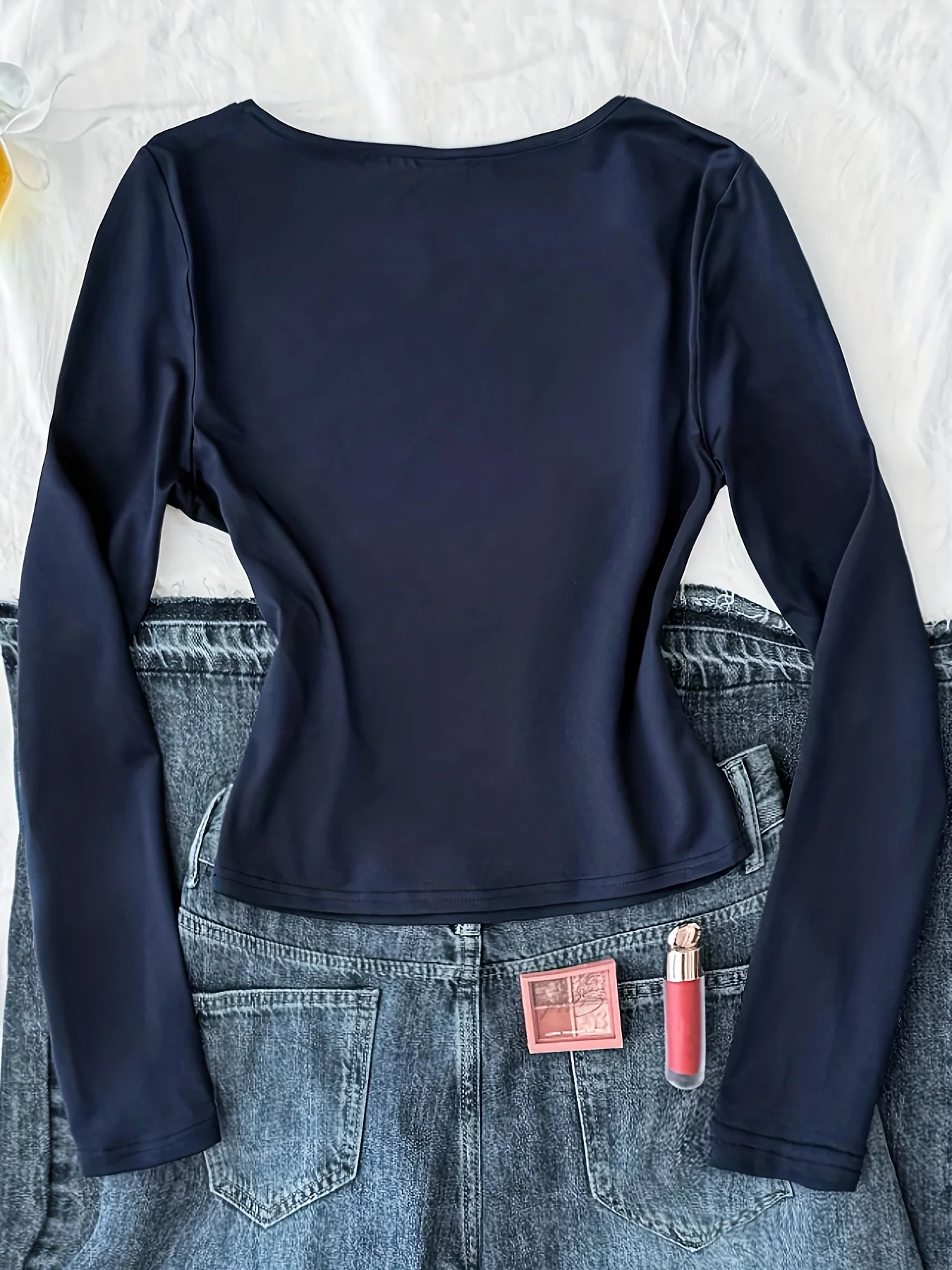 A beautiful and charming chest-hugging T-shirt in royal blue with a white lace collar and bow decoration