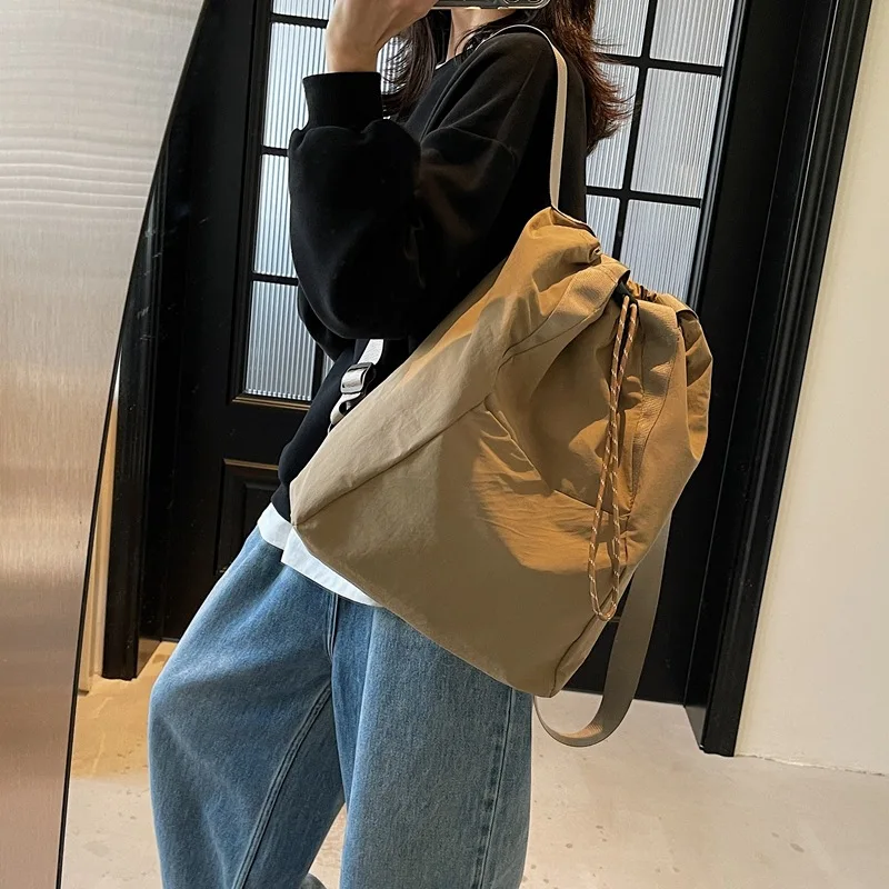 Light casual women's bag draw rope mouth large capacity simple multi-functional hand lashable shoulder backpack