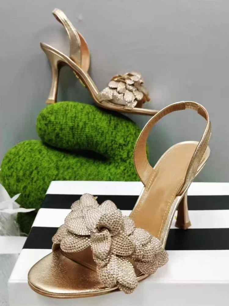 

Paired with skirt, rhinestone flower gold high heels, women's 2024 summer new French slim heel sexy open toe sandals