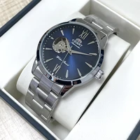 Reloj Orient automático con corazón abierto para hombre, esfera azul, banda de acero inoxidable, reloj de pulsera informal, reloj de moda resistente al agua hasta 30M