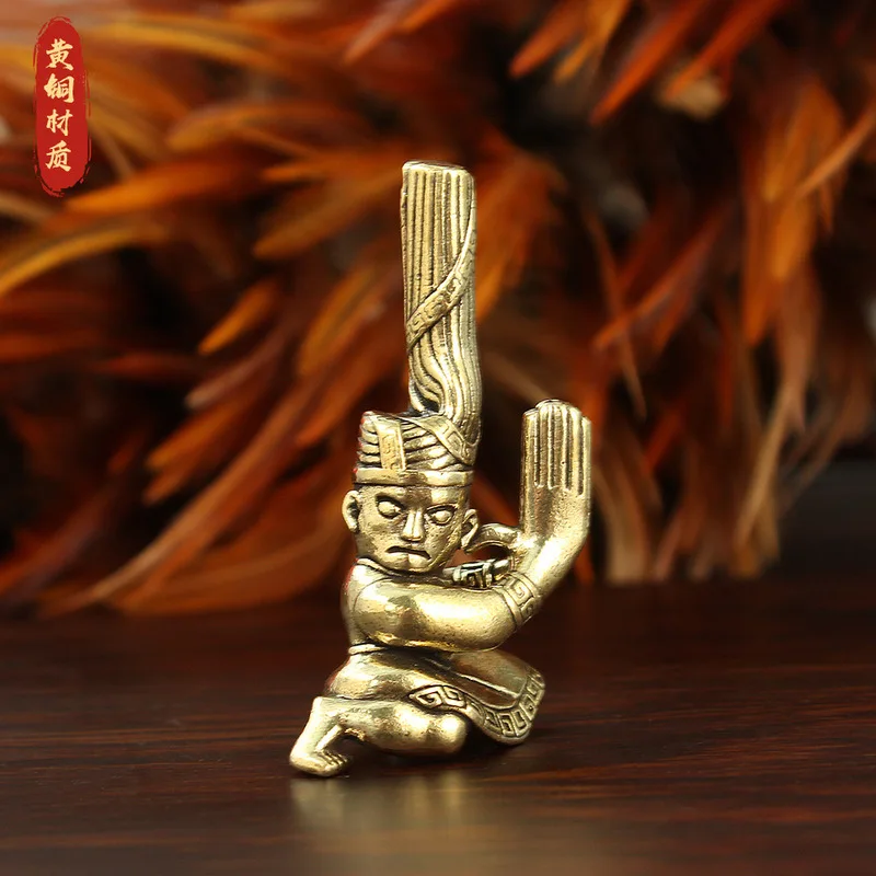 Brass figure statue, twisted head, kneeling posture, Guanghan Sanxingdui creative scenic area, prominent eye