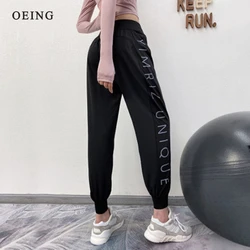 Pantaloni sportivi a vita alta pantaloni da jogging Mujer elasticizzati stampati con lettera laterale moda donna comodi pantaloni da corsa larghi e traspiranti