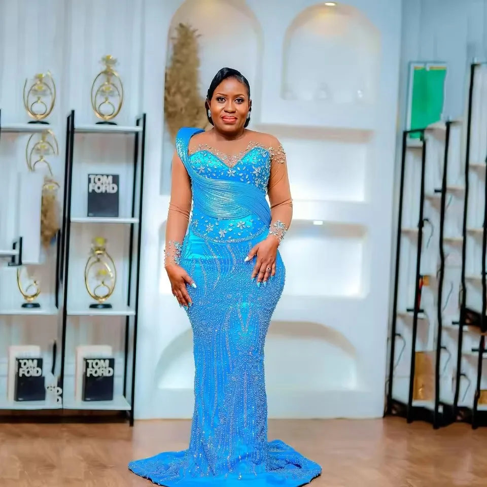 

Вечернее платье Aso Ebi 2026: Небесно-голубое, с иллюзорными прозрачными вставками, в королевском стиле, с цветочным узором, с рукавами, расшитое бисером, длинное, фасон «русалка»
