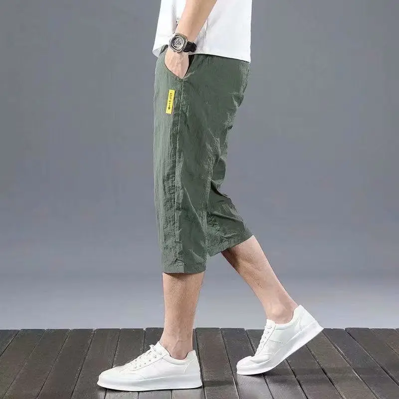 Pantalones cortos de seda de hielo para hombre, Bermudas finas a la moda, de secado rápido, para playa, color negro