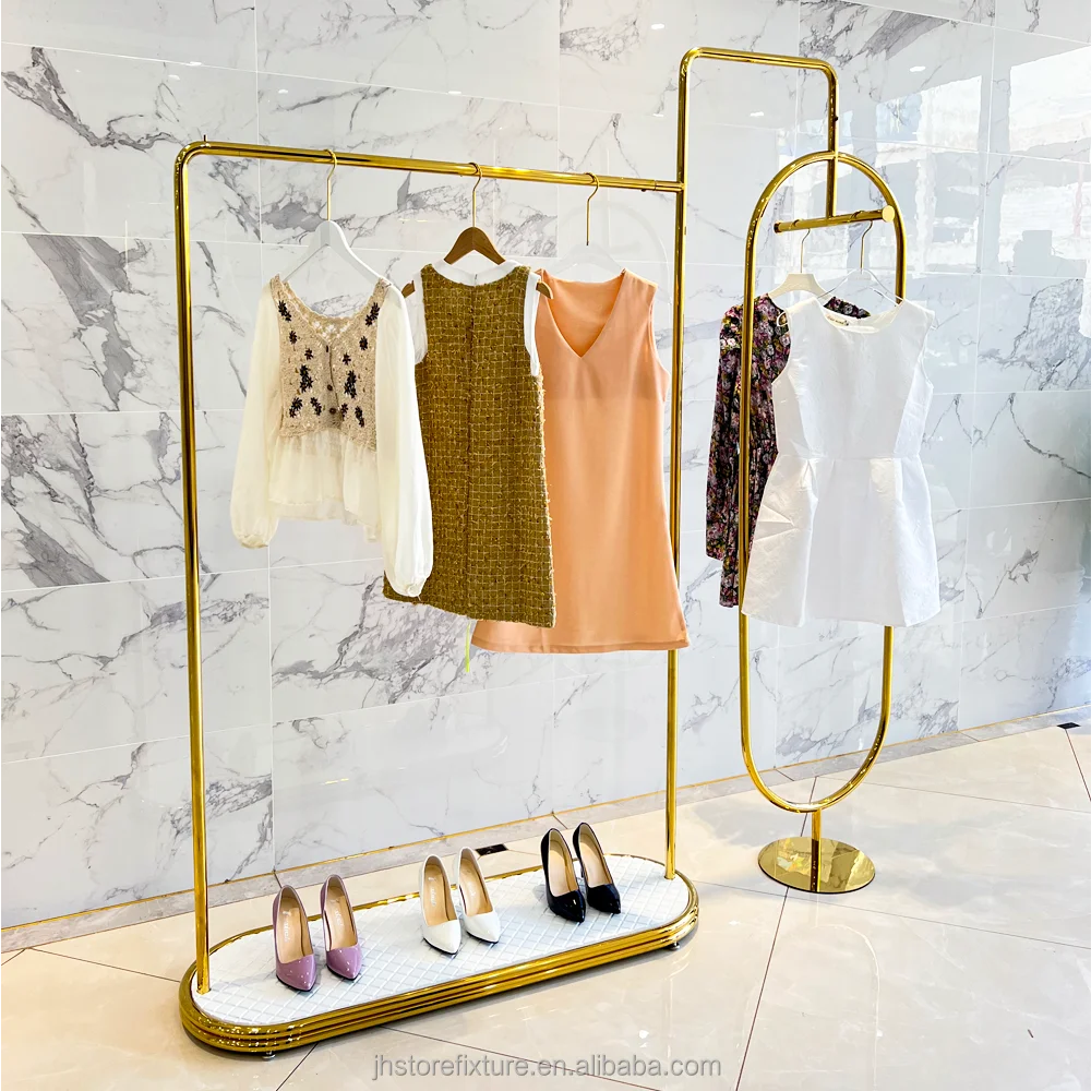 Percha de ropa de acero inoxidable de lujo, dorada brillante, personalizada, de pie, con estantes de exhibición para tienda