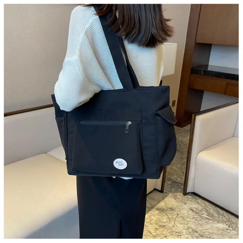 المرأة حقيبة كتف الموضة فئة سعة كبيرة طالب حمل حقيبة 2025 جديد قماش ركاب حمل حقيبة حقيبة نسائية
