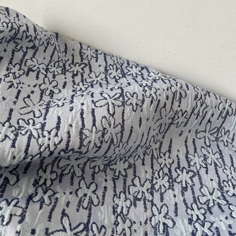 

Blue three-dimensional woven small flower polyester fabric for waistcoat, jacquard clothing, handmade fabric