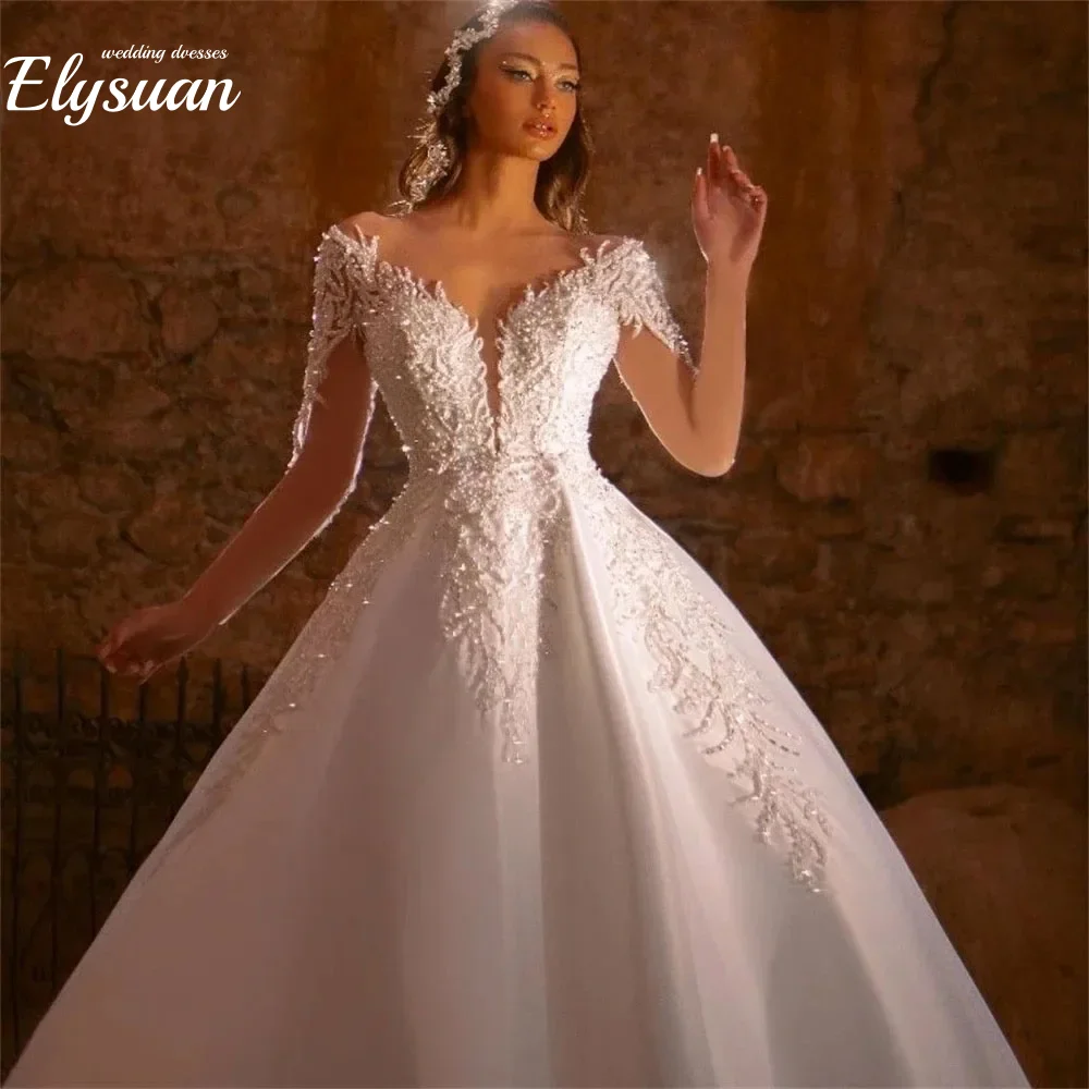 ชุดแต่งงานลูกปัดหรูหราสั่งทำพิเศษ แขนยาวแบบโปร่งแสง ประดับด้วยลายปัก พร้อมชายกระโปรงยาวแบบลากพื้น สำหรับเจ้าสาวไซส์พลัส