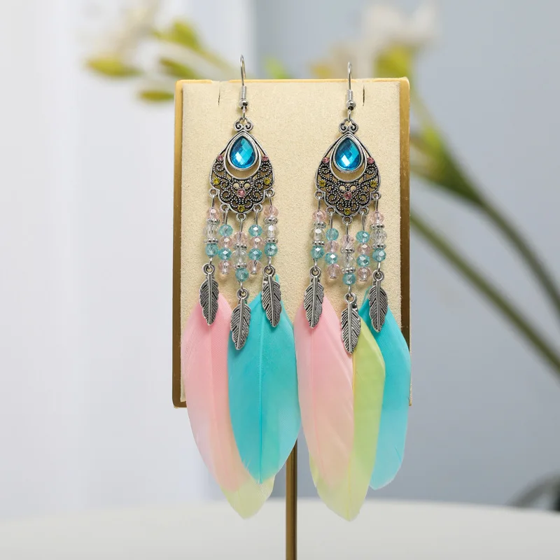 2026 الخاص بك Tixi البيضاوي مزاجه ريشة أقراط العرقية نمط كريستال أقراط Yunguichuan السفر المجوهرات بالجملة