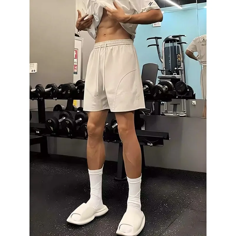 

Men's Quick Drying Sports Shorts Thin Loose Running and Fitness Training Pants Solid Color Drawstring Straight Shorts 3 Colors