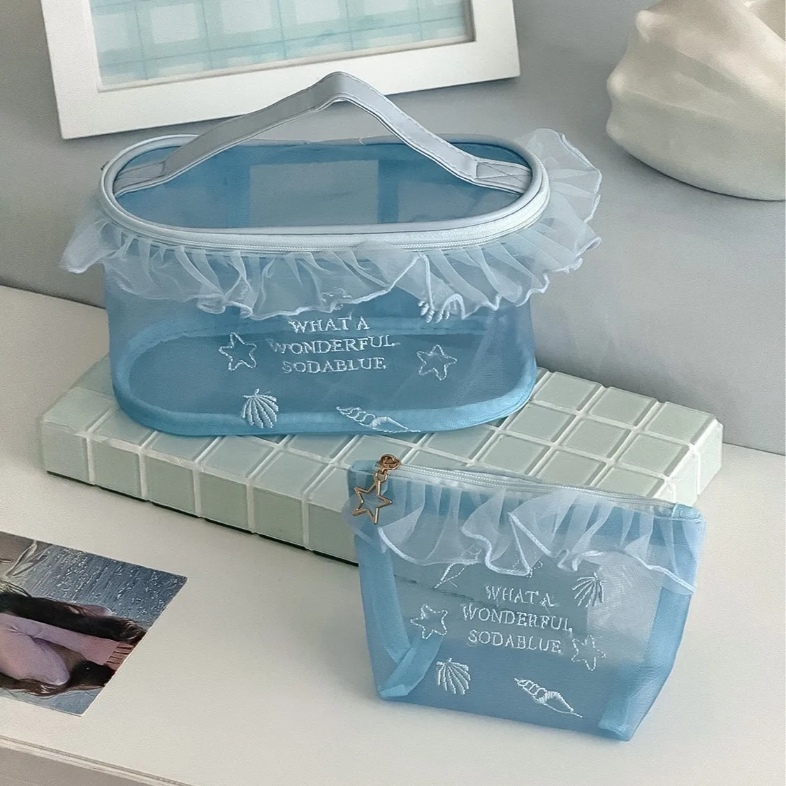 Cross-border ocean blue mesh yarn bag high-value girl's heart ins wind embroidery hollow portable lipstick sample cosmetic bag