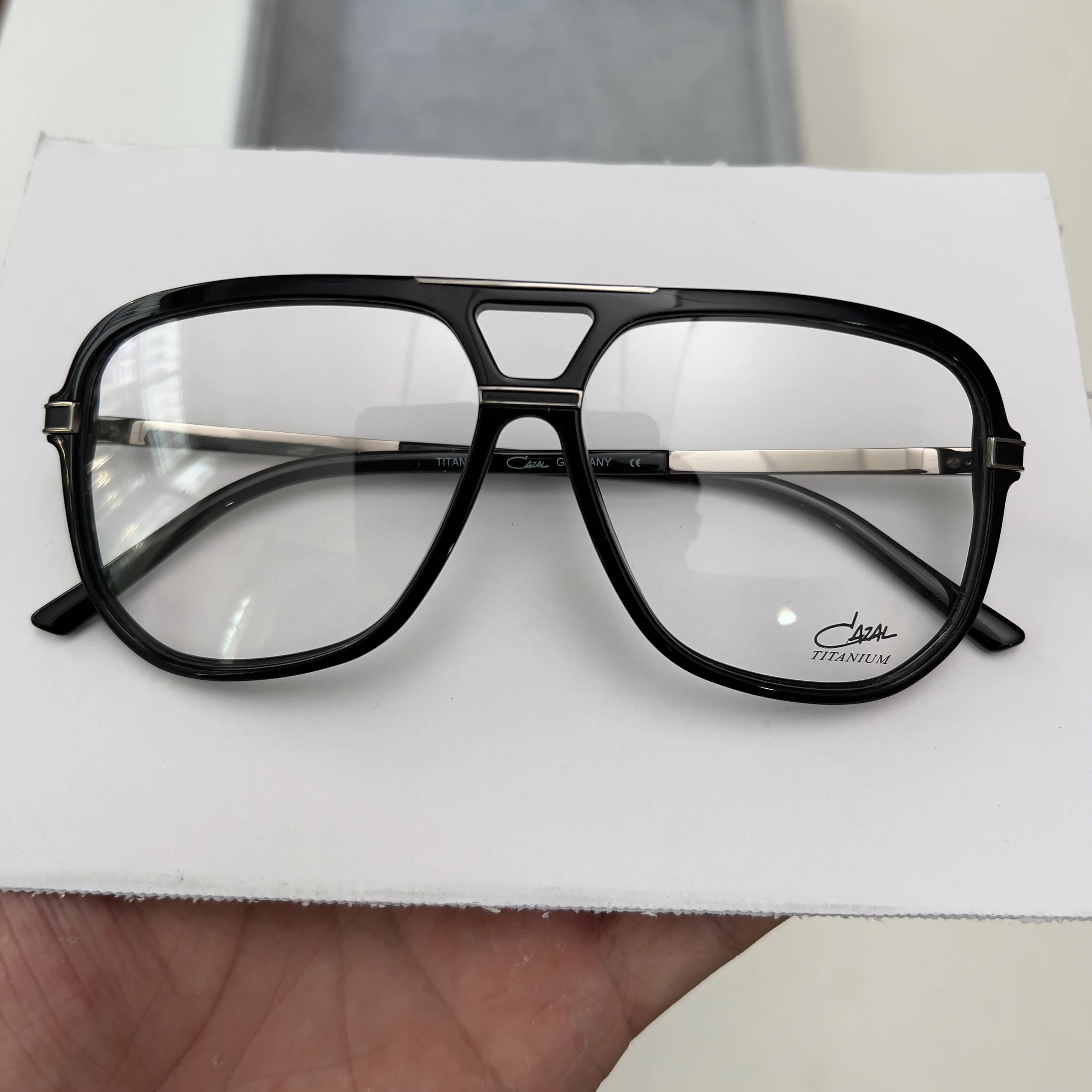 

German Designer Eyewear Brand: Large Unisex Style with Hinged Arms & Black Acetate Fiber Frame